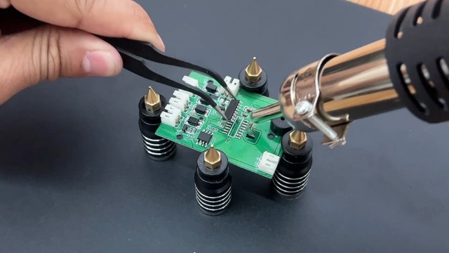 Desoldering small components with a rework station.