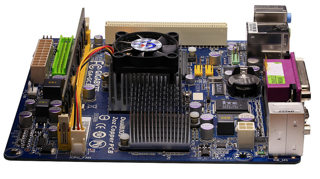Dense PCB with heat sink and fan for advanced cooling.