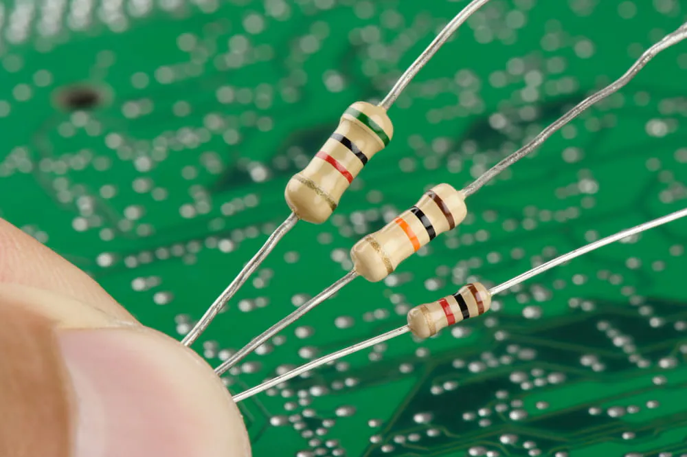 Close-up of a resistor showing color bands for value identification