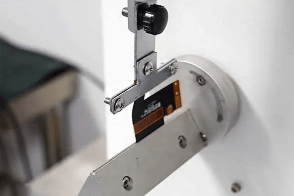Flex PCB undergoing PCB bend radius test
