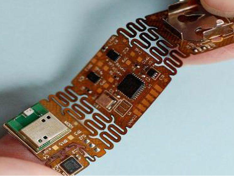 Polyimide PCB undergoing bend test after conformal coating