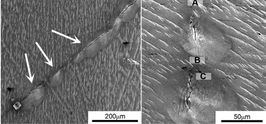 'High-magnification SEM image showing copper plating and microcracks inside a failed via