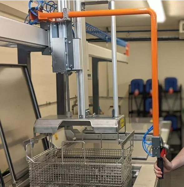 Technician performing ultrasonic cleaning on a frameless stencil