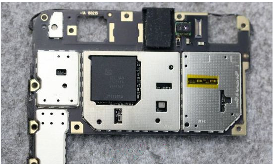 Photograph of a 12-layer PCB with metal shield cans installed over sensitive circuitry