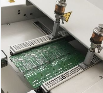 Measuring PCB warpage with a dial gauge on a flat reference surface