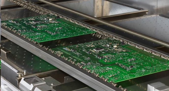 Standard thickness PCB supported on a flat jig during through-hole soldering