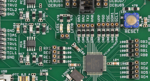 Close-up of optimized small-font silkscreen on a dense PCB layout showing component labels and polarity marks